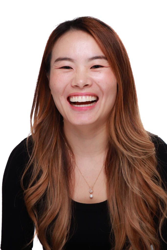 Patient smile portrait | Rucker Orthodontics A Rucker Orthodontics patient smiling in a studio portrait.